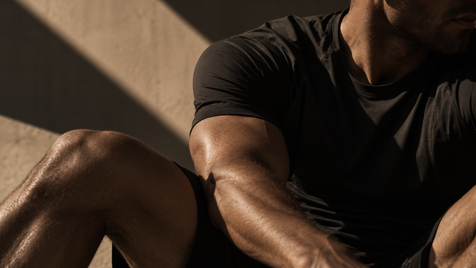 Close-up of a male athlete in a black performance T-shirt