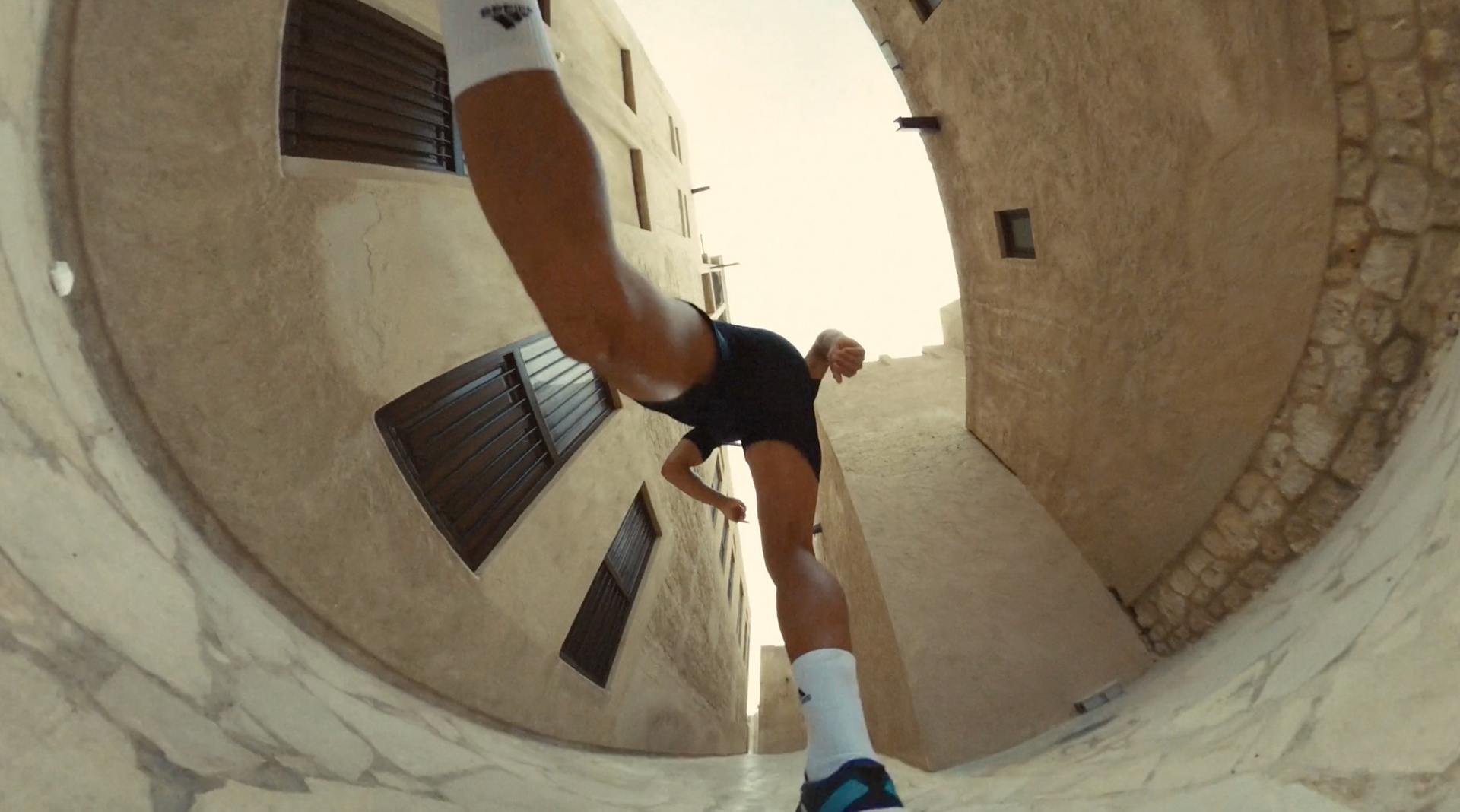 Runner moving through an urban passage